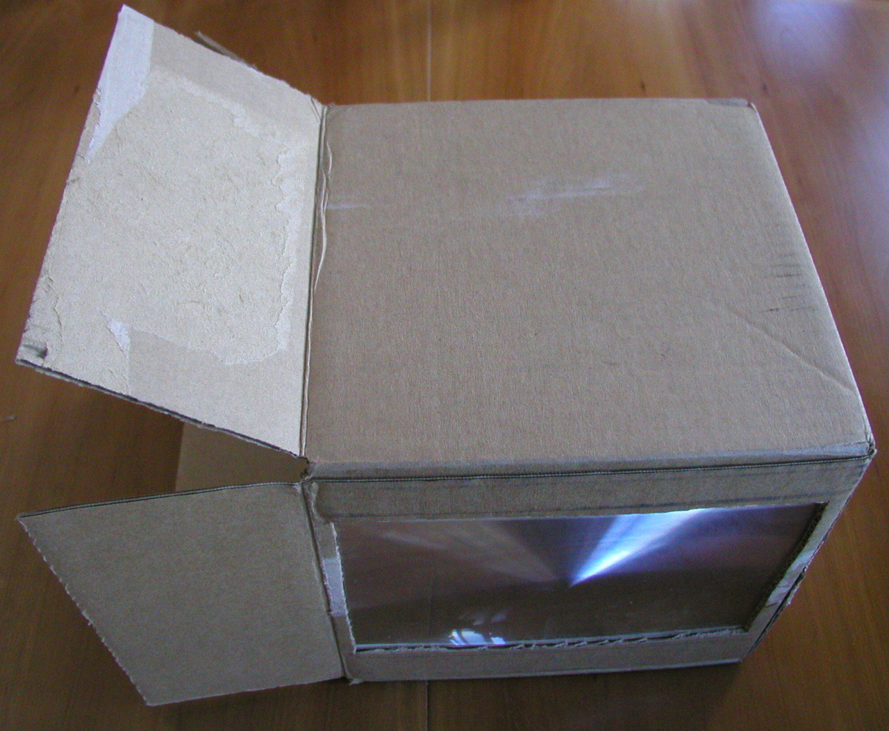 Box with lens